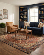 Azar Brick & Navy rug in a New England living room with navy bookshelves and a navy sofa