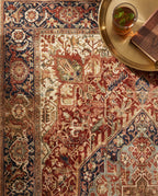 Close-up of the Azar rug medallion and navy border, soft low-pile velvet