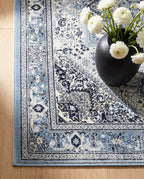 Close-up of the Darya rug sky-blue border and ink motifs, soft low-pile velvet