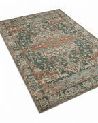 Golbahar Jade & Rust rug, angled view showing the full design