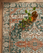 Close-up of the Golbahar rug moss green field and rust medallion, soft low-pile velvet