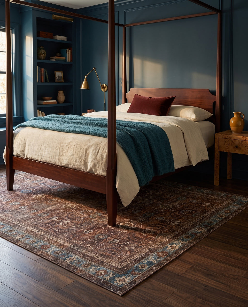 Kahroba Walnut & Teal rug under a mahogany four-poster bed with a teal wool blanket