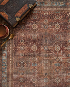 Close-up of the Kahroba rug walnut field and faded teal border, soft low-pile velvet