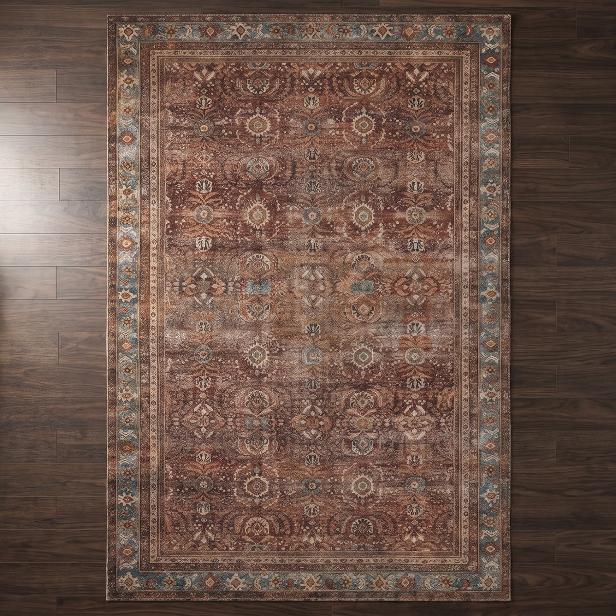 Kahroba Walnut & Teal rug seen from above on a dark walnut floor