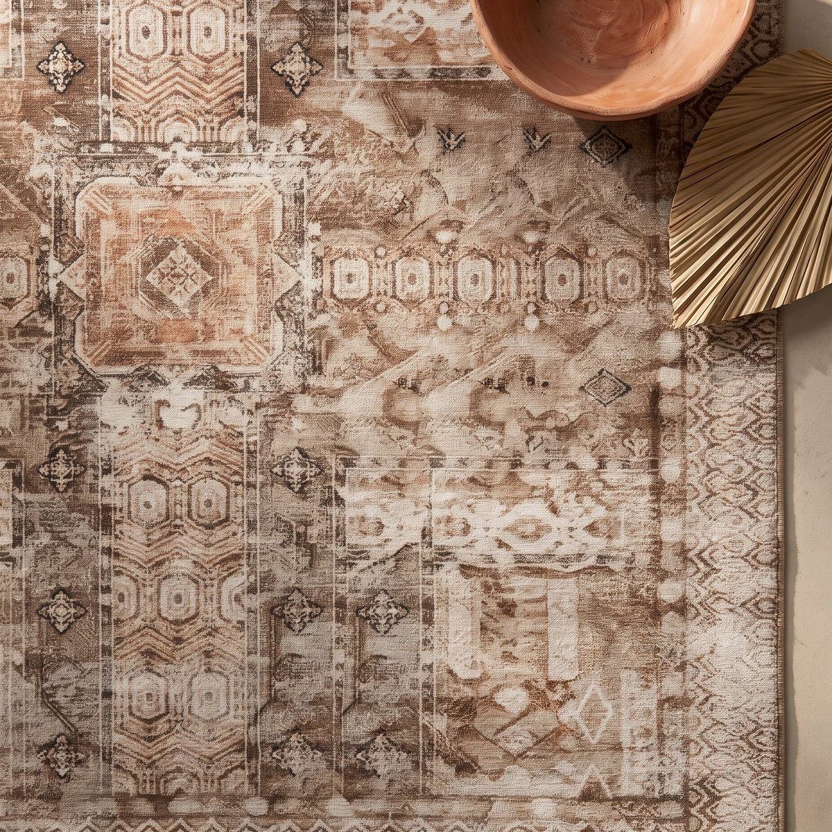 Kavir rug with a terracotta bowl and a dried palm leaf