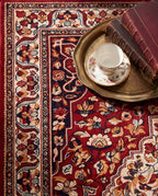 Close-up of the Laleh rug border and garnet field, soft low-pile velvet