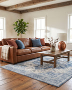 Mahtab Denim & Cream rug in a modern ranch living room with a cognac leather sofa