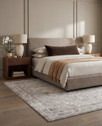 Morvarid Dove & Pearl rug under a taupe bouclé bed in a quiet luxury bedroom