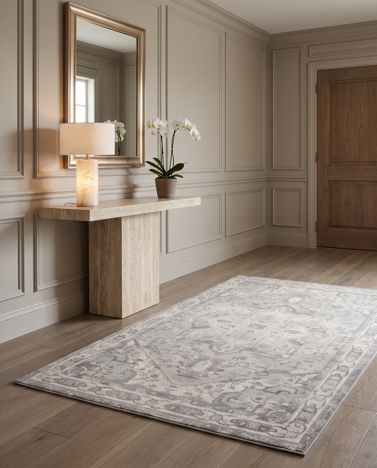 Morvarid Dove & Pearl rug in an entryway with a travertine console