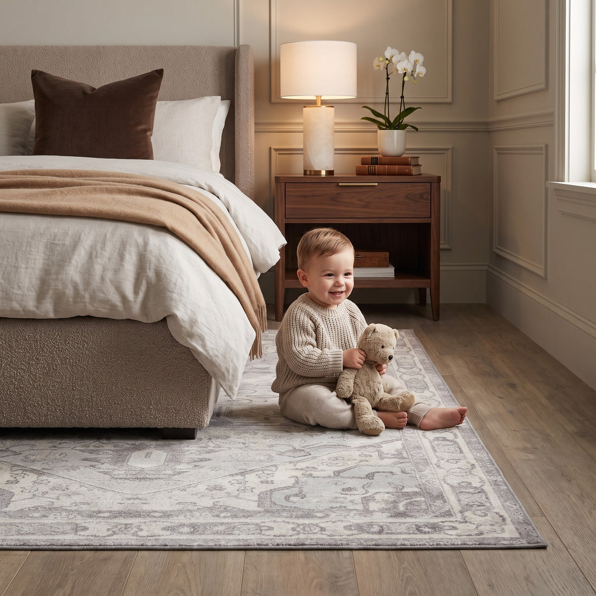 Toddler with a teddy bear on the Morvarid Dove & Pearl rug