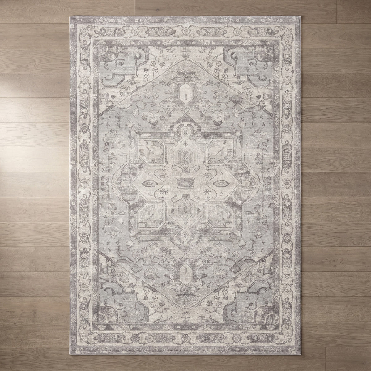 Morvarid Dove & Pearl rug seen from above on a greige oak floor
