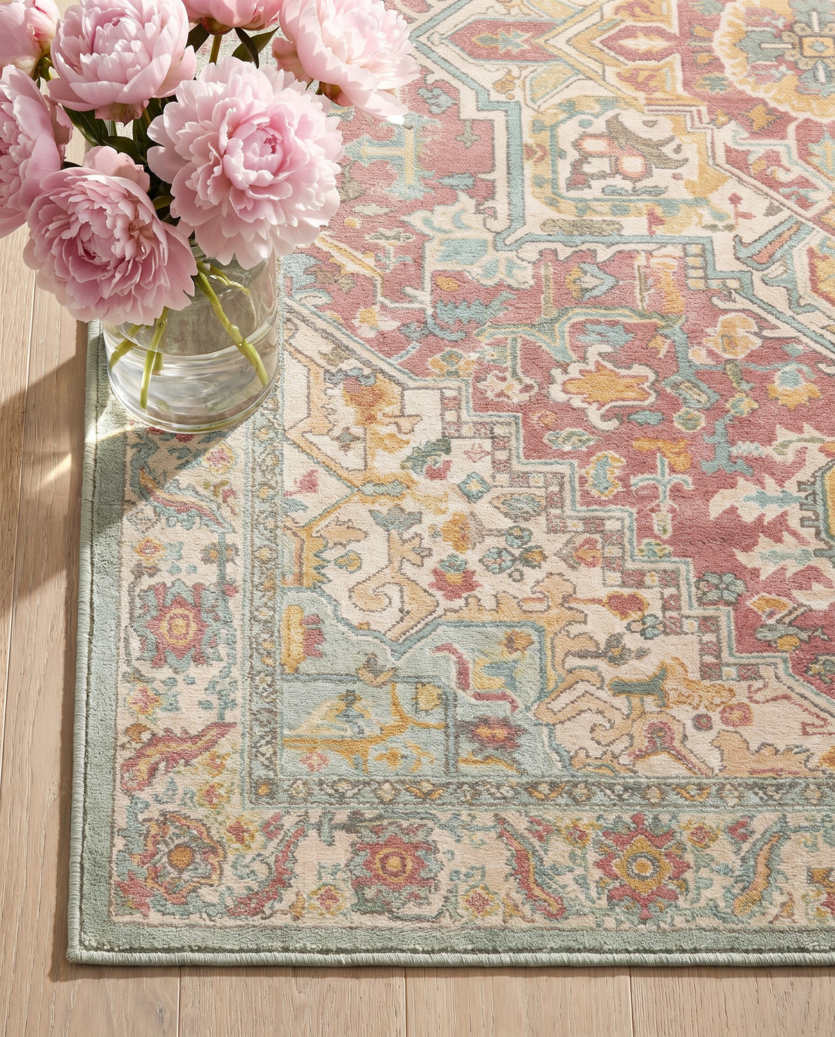 Close-up of the Nasrin rug border and dusty rose field, soft low-pile velvet