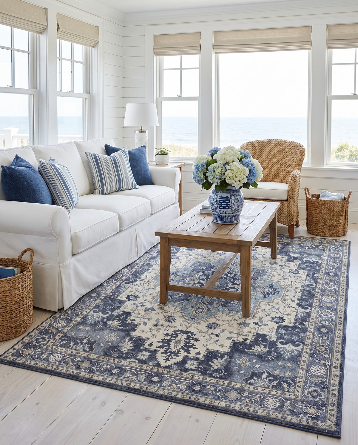 Nilufar Indigo & Ivory rug in an East Coast coastal living room with a white slipcovered sofa