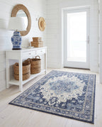 Nilufar Indigo & Ivory rug in a white shiplap entryway with a blue and white lamp