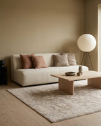 Pardis Oat & Clay rug in a warm Japandi living room with a cream bouclé sofa