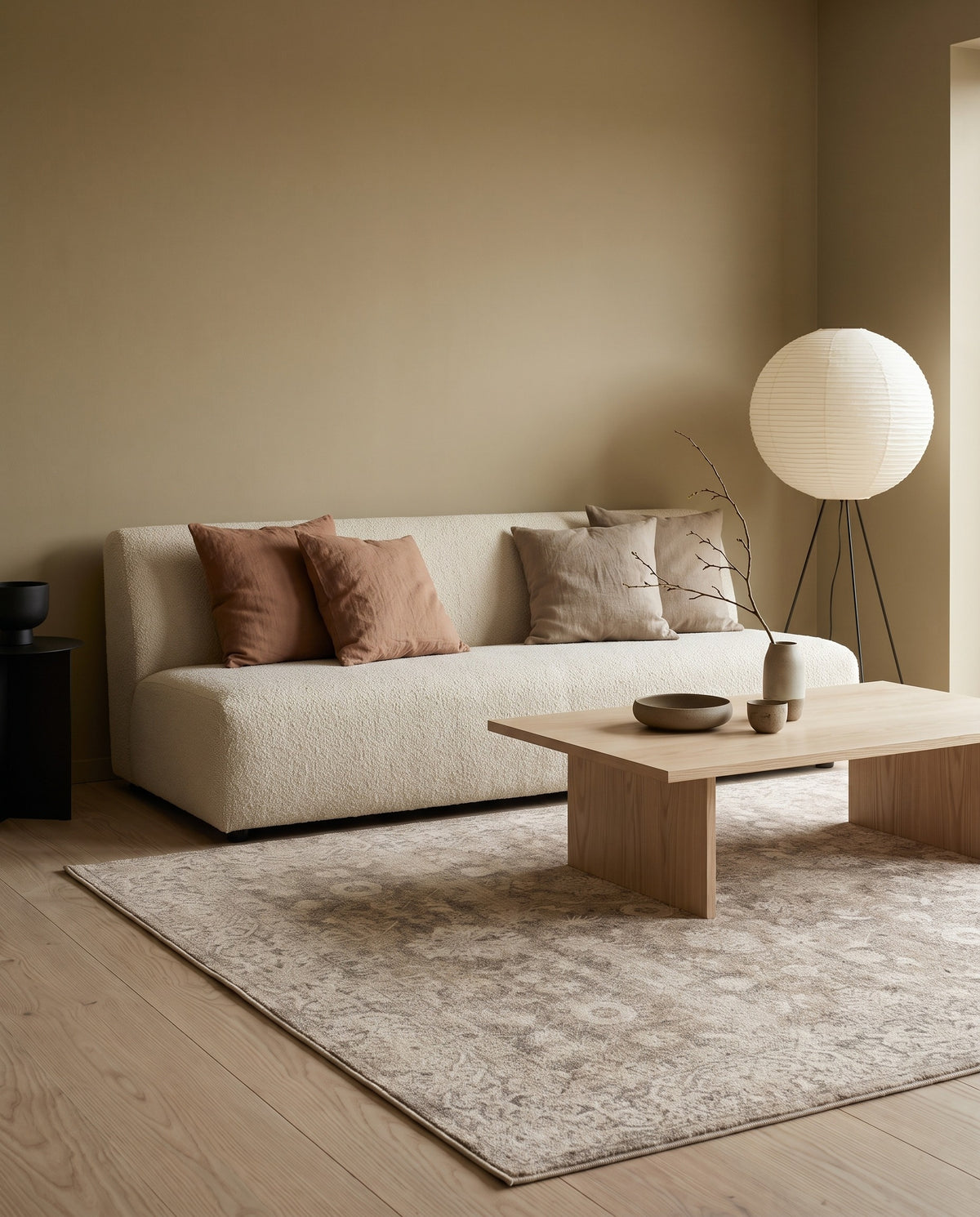 Pardis Oat & Clay rug in a warm Japandi living room with a cream bouclé sofa