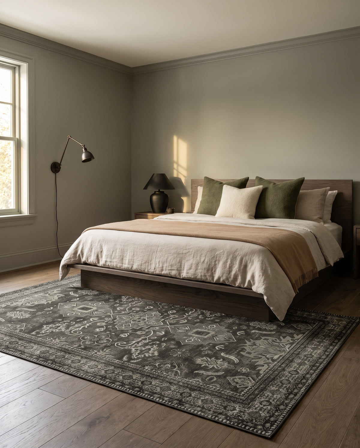 Shabnam Charcoal & Olive rug under a smoked-oak bed in a cocooning bedroom
