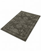 Shabnam Charcoal & Olive rug, angled view showing the full design