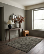 Shabnam Charcoal & Olive rug in an entryway with a smoked-oak console