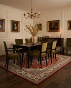 Shahrzad Crimson & Navy rug in a warm classic dining room with olive velvet chairs