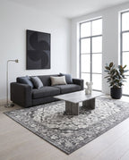 Simin Ash & Ivory rug in a minimalist gallery-style living room with a charcoal bouclé sofa