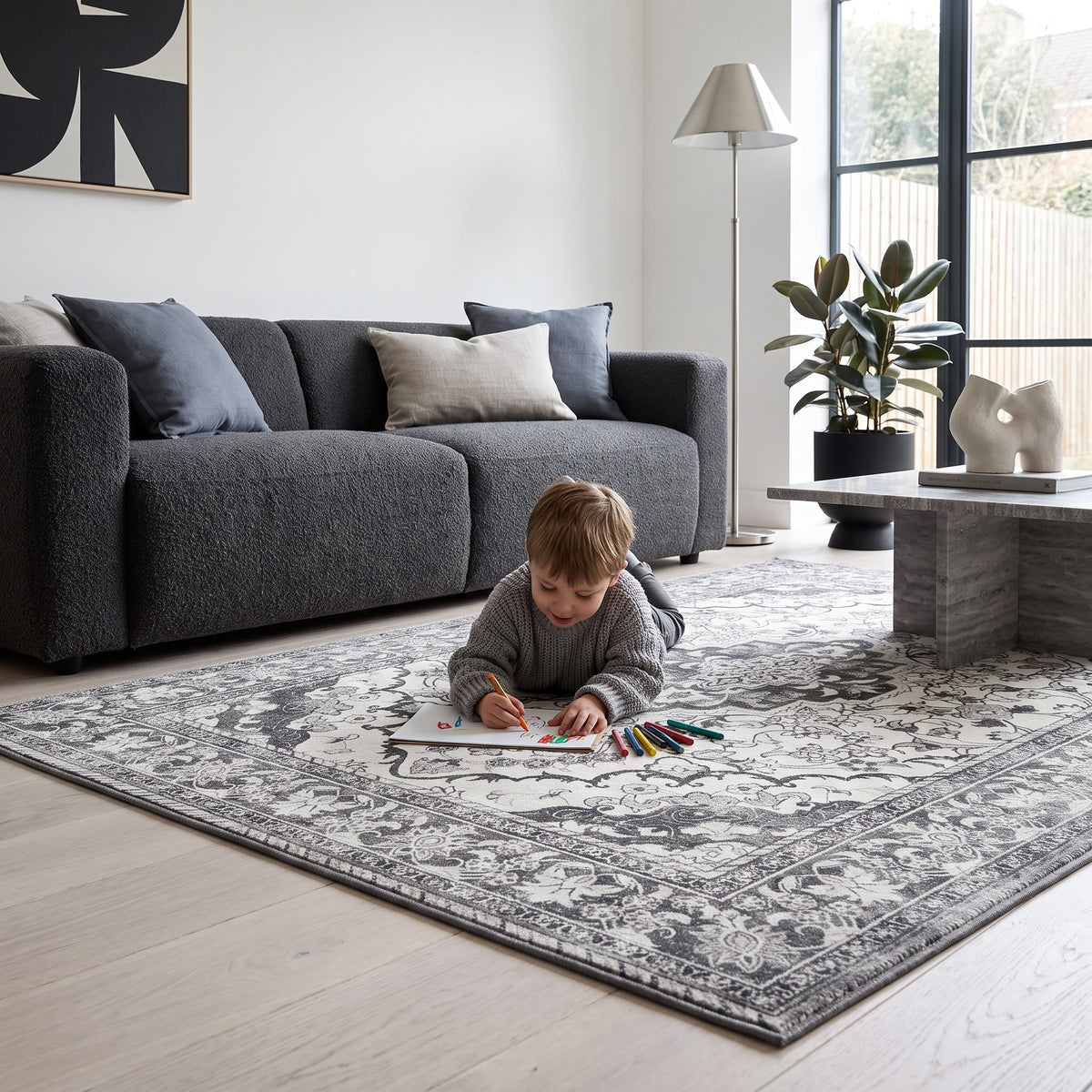 Child drawing with crayons on the Simin Ash & Ivory rug