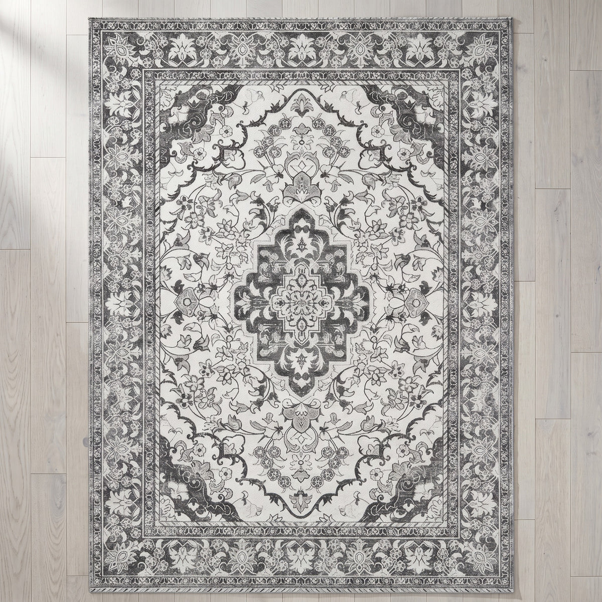 Simin Ash & Ivory rug seen from above on a pale ash floor