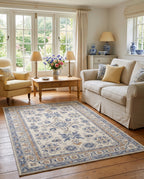 Yasaman Ivory & Cornflower rug in an English cottage living room with a cream skirted sofa