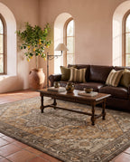 Zarin Ochre & Umber rug in a Spanish Mediterranean living room with a chocolate leather sofa