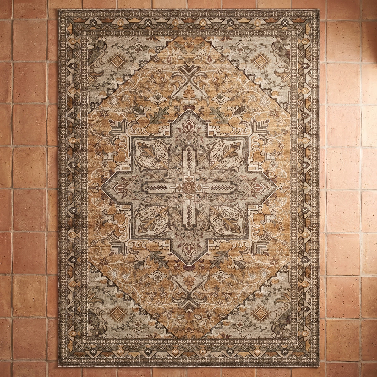 Zarin Ochre & Umber rug seen from above on a terracotta tile floor