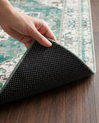 Dotted non-slip backing of the Zomorrod rug