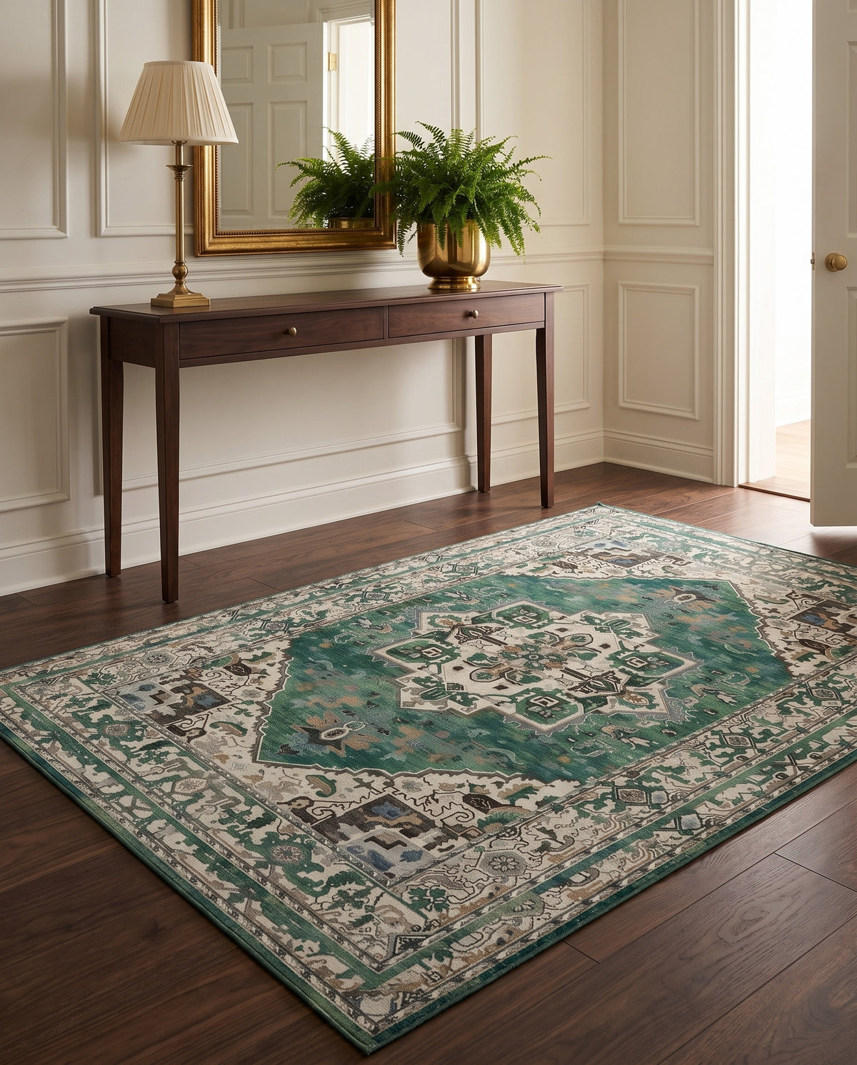 Zomorrod Emerald & Ivory rug in a classic entryway with a walnut console and gilded mirror